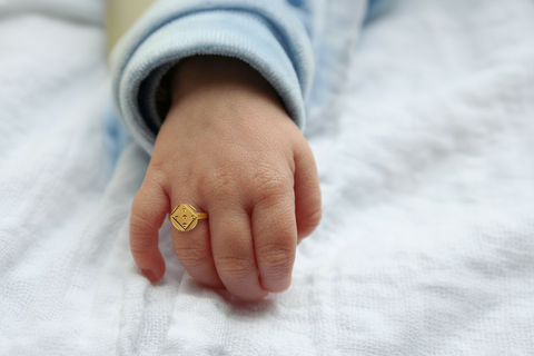 22k Yellow Gold Baby Ring in size 2 and total gold weight of 1.05g